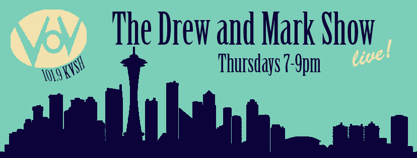 The Drew and Mark Show, Thursdays 7-9pm live! on Voice of Vashon 101.9 KVSH, over a city skyline